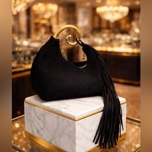 Avant Garde Black Clutch/Wristlet Bag with a Curved Gold Handle